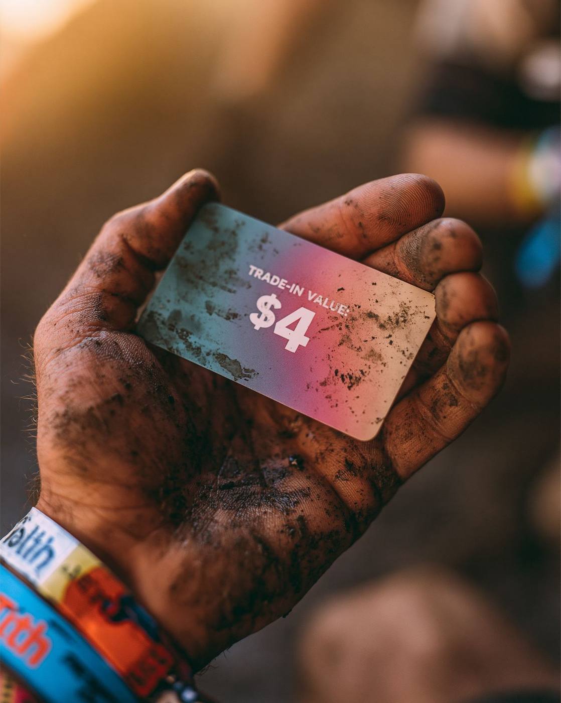A four dollar trade-in voucher in a muddy hand